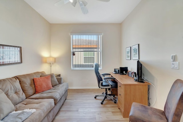 home office featuring ceiling fan and light hardwood / wood-style floors