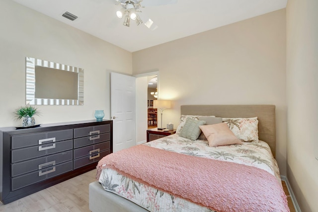 bedroom with ceiling fan and light hardwood / wood-style floors