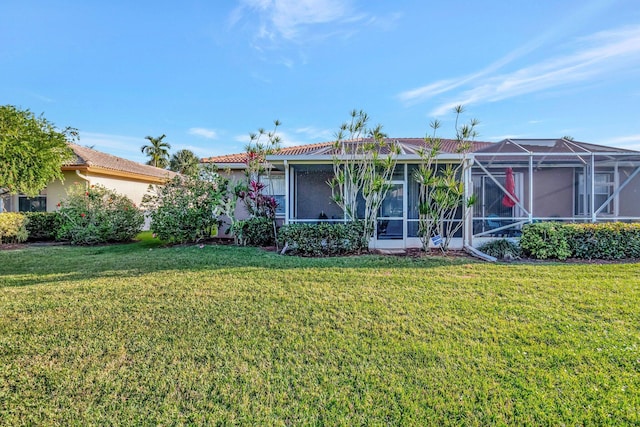 view of front facade with a lanai and a front yard