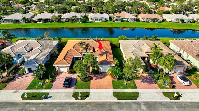 birds eye view of property featuring a water view