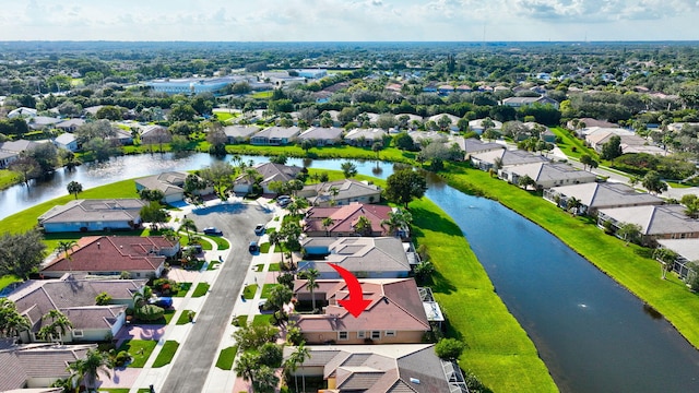 drone / aerial view with a water view