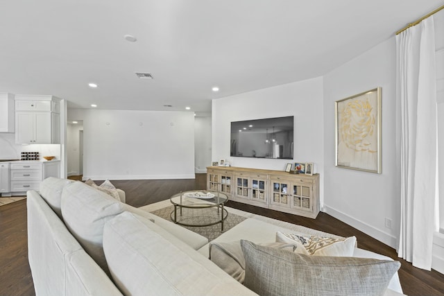 living room featuring dark hardwood / wood-style floors