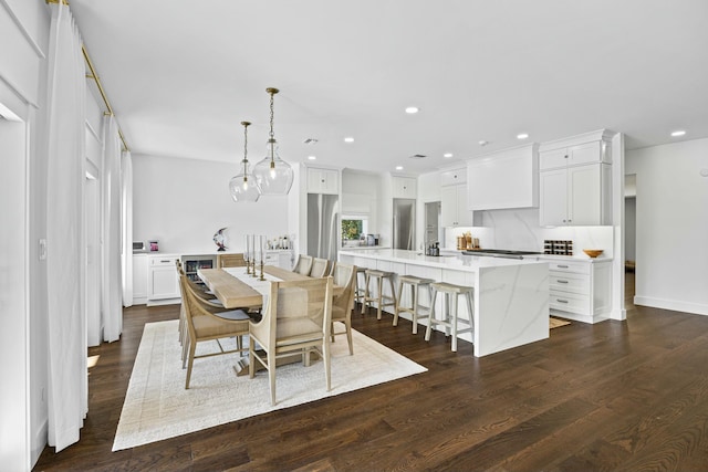 dining room featuring dark wood-type flooring and wine cooler