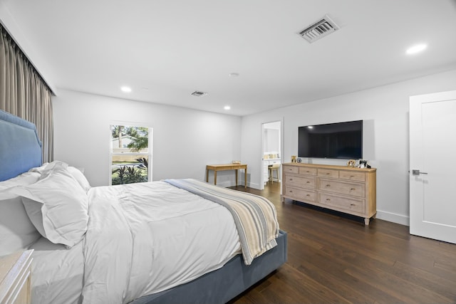 bedroom with dark wood-type flooring