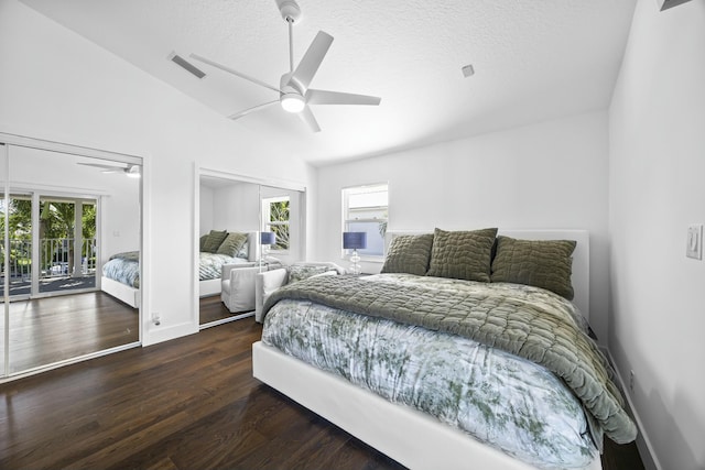 bedroom featuring access to outside, multiple windows, ceiling fan, and dark wood-type flooring