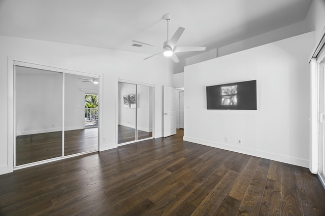 unfurnished bedroom featuring vaulted ceiling, ceiling fan, and dark wood-type flooring