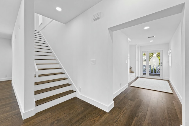 foyer with dark hardwood / wood-style flooring