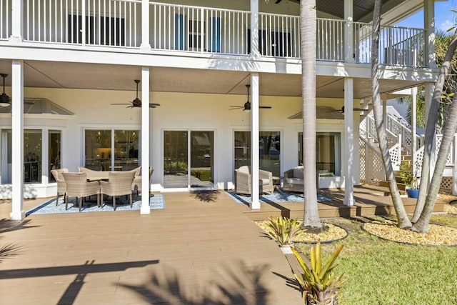 view of patio with outdoor lounge area, ceiling fan, and a deck