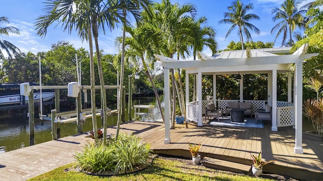 view of dock with an outdoor living space and a water view