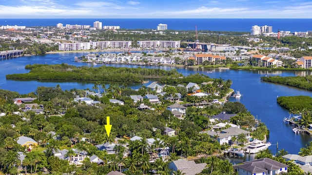 birds eye view of property with a water view