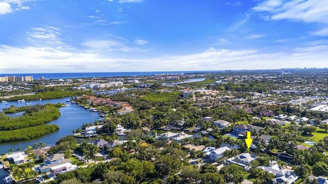 birds eye view of property featuring a water view