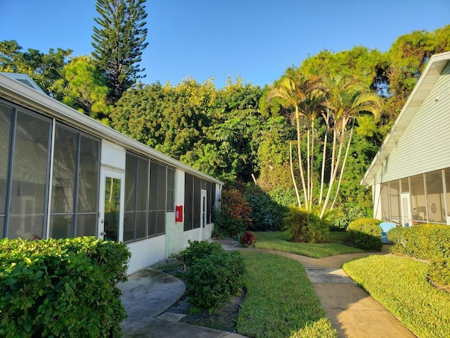 view of yard with a sunroom