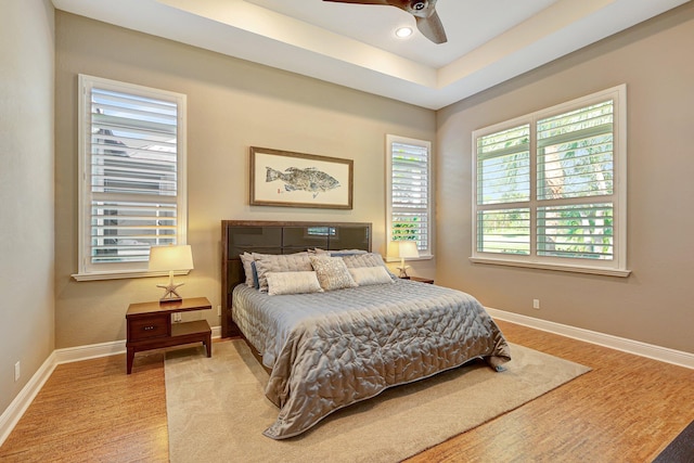 bedroom featuring ceiling fan and light hardwood / wood-style floors