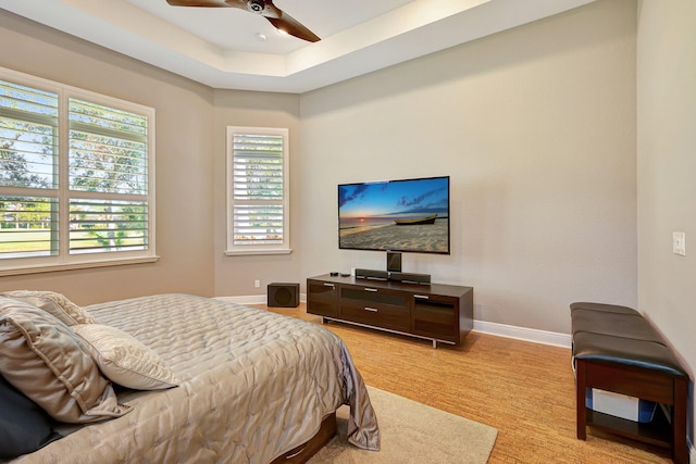 bedroom with light carpet and ceiling fan