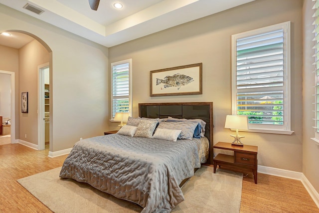 bedroom with ceiling fan and light hardwood / wood-style flooring