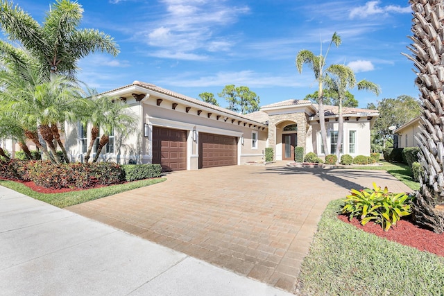 mediterranean / spanish house with a garage