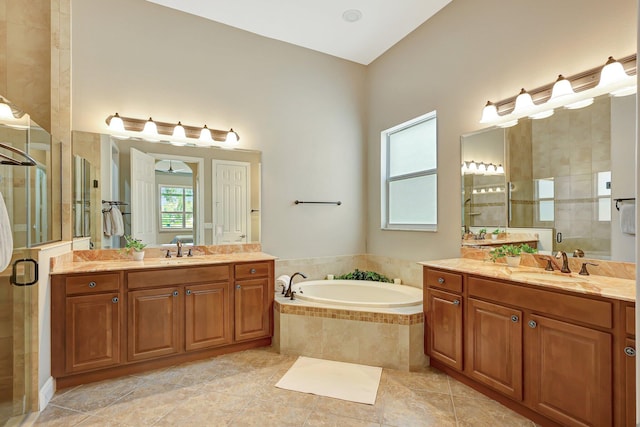 bathroom with tile patterned floors, vanity, ceiling fan, and plus walk in shower