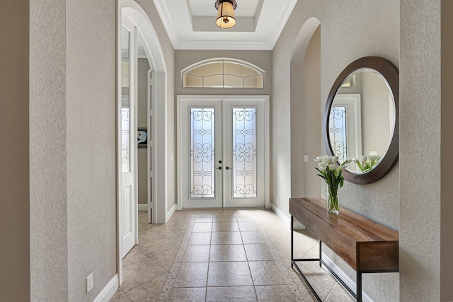 entryway featuring french doors and crown molding