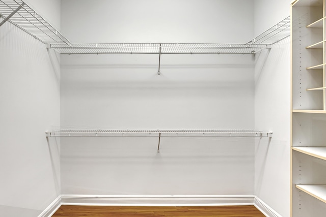 walk in closet featuring hardwood / wood-style floors