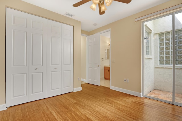 unfurnished bedroom with ceiling fan, light hardwood / wood-style floors, and a closet