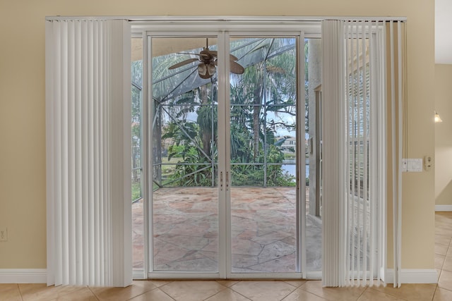 entryway featuring light tile patterned floors and ceiling fan