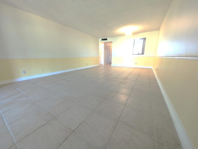 unfurnished sunroom featuring ceiling fan