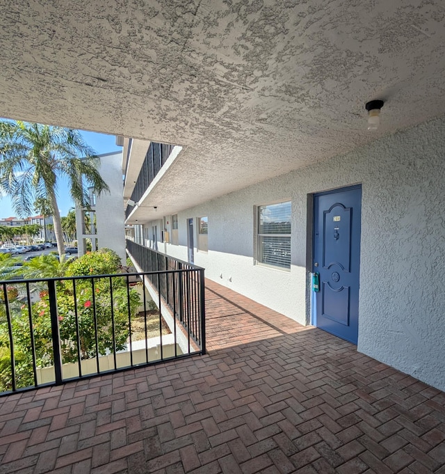 view of patio with a balcony