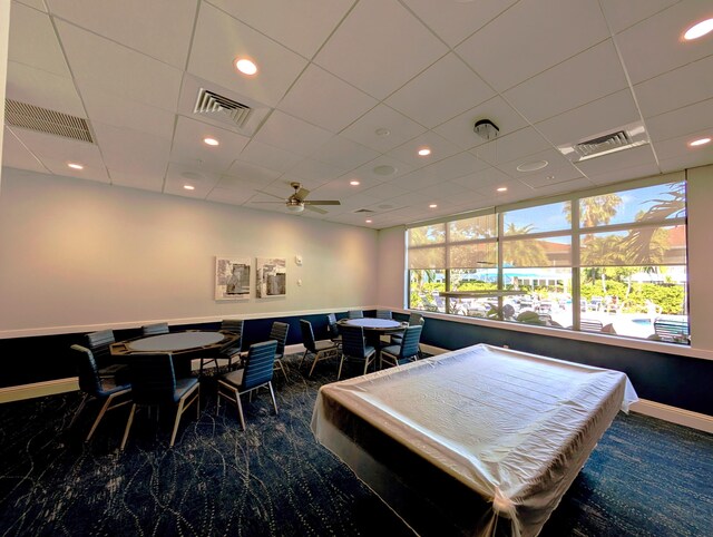 exercise room with a paneled ceiling