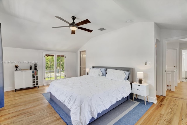 bedroom with access to exterior, ceiling fan, lofted ceiling, and light wood-type flooring