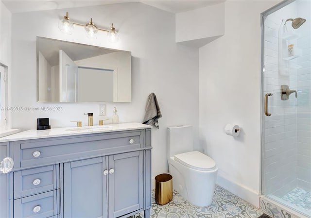 bathroom with tile patterned flooring, a shower with door, vanity, and toilet