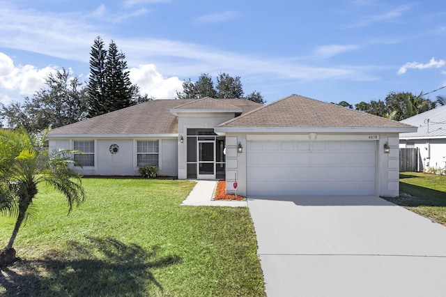 single story home with a garage and a front lawn