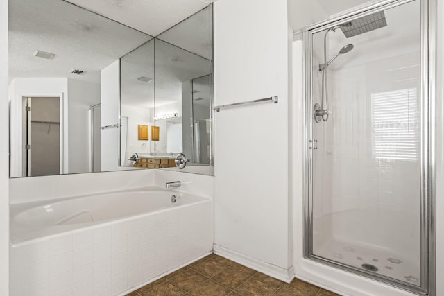 bathroom featuring tile patterned flooring and independent shower and bath