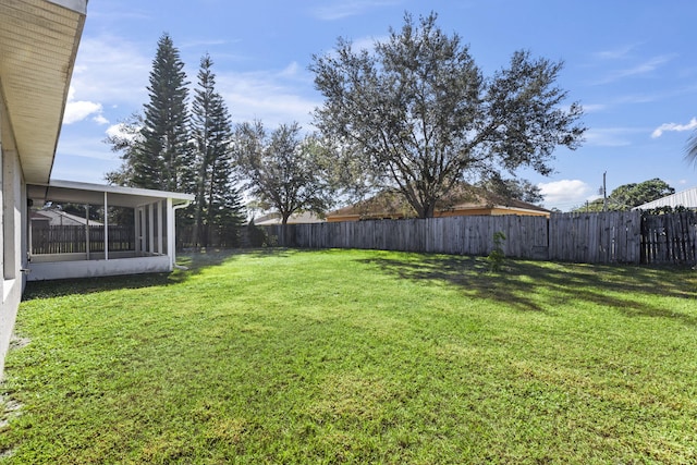 view of yard with a sunroom