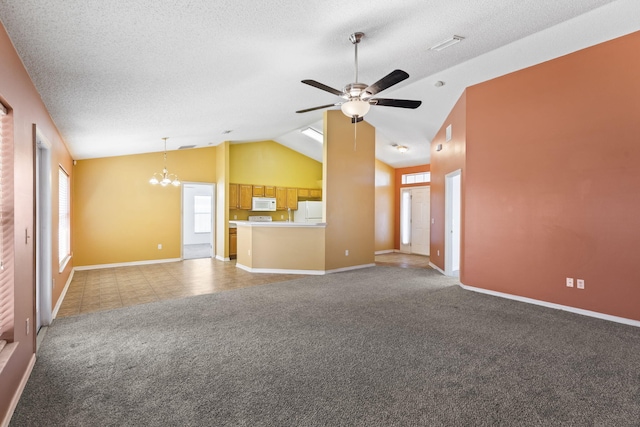 unfurnished living room with a textured ceiling, ceiling fan with notable chandelier, light colored carpet, and vaulted ceiling