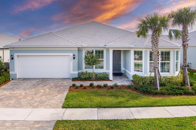 single story home with a garage