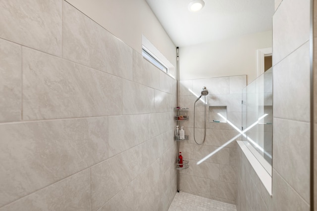 bathroom featuring tiled shower