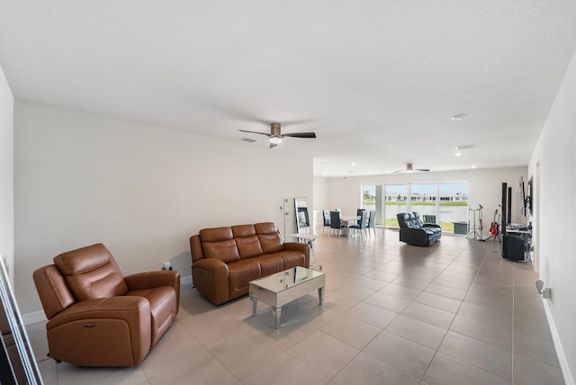 tiled living room with ceiling fan