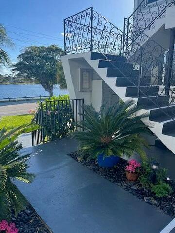 302 Lake Osborne Dr Unit 19, Lake Worth, FL 33461 - view of patio featuring a water view