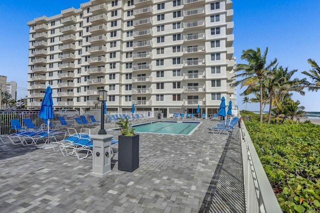 view of swimming pool with a patio area