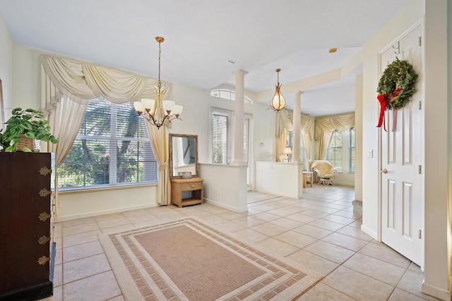 interior space with a chandelier and light tile patterned floors