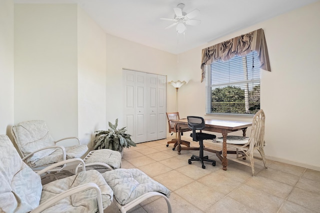 office space featuring ceiling fan and light tile patterned floors