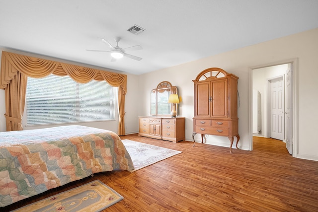 bedroom with light wood-type flooring and ceiling fan