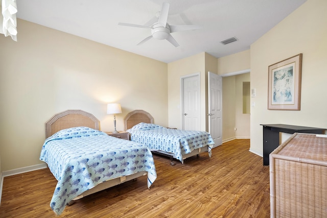 bedroom featuring hardwood / wood-style flooring and ceiling fan