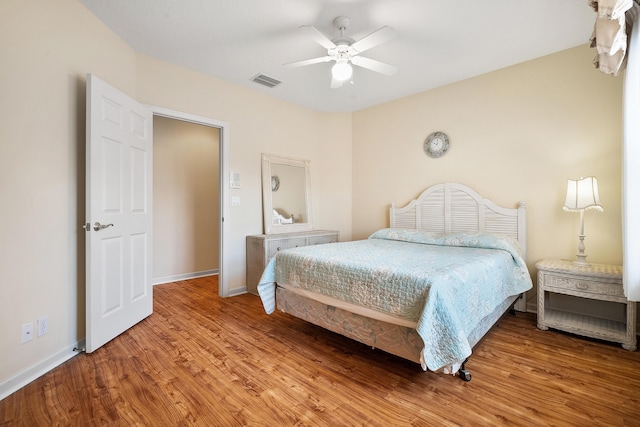 bedroom with hardwood / wood-style floors and ceiling fan