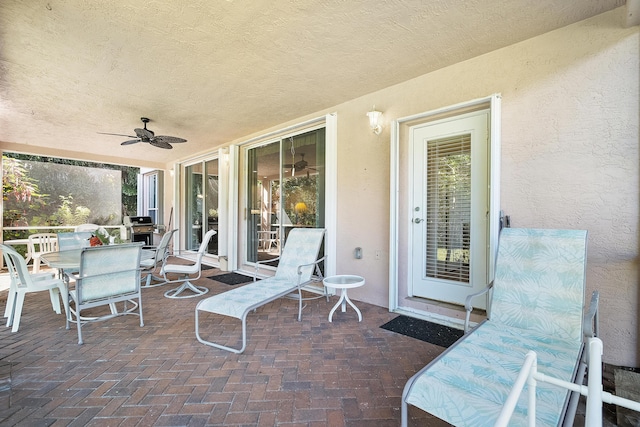 view of patio featuring ceiling fan