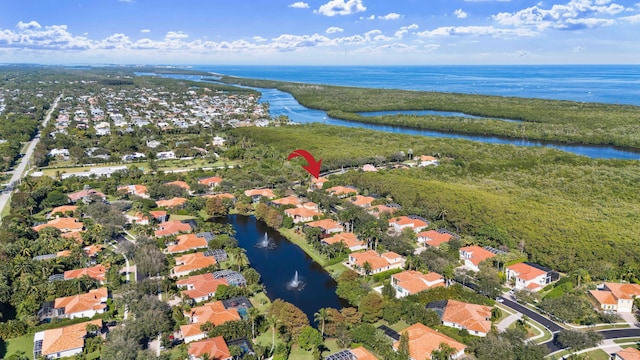 drone / aerial view with a water view