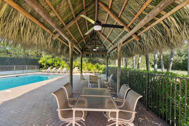 view of pool with a gazebo, ceiling fan, and a patio area