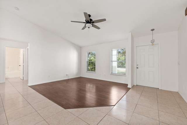 unfurnished living room featuring ceiling fan, lofted ceiling, and light hardwood / wood-style flooring