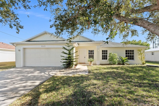 single story home featuring a front lawn and a garage