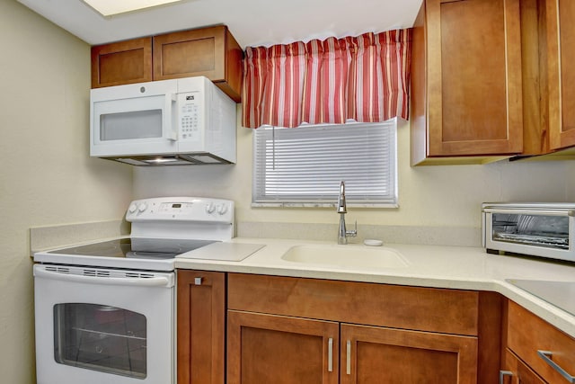 kitchen with white appliances and sink